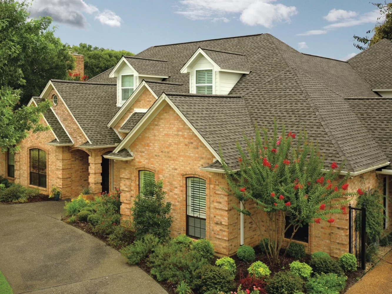 Beautiful brick house with a newly installed architectural shingle roof